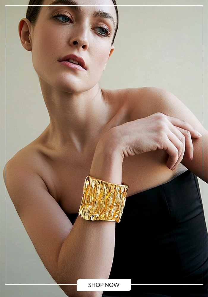 Gold plated hammered cuff serving as a statement piece