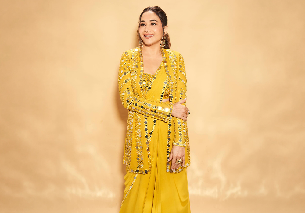 Madhuri Dixit wearing mirror-work Seema Gujral yellow jacket saree