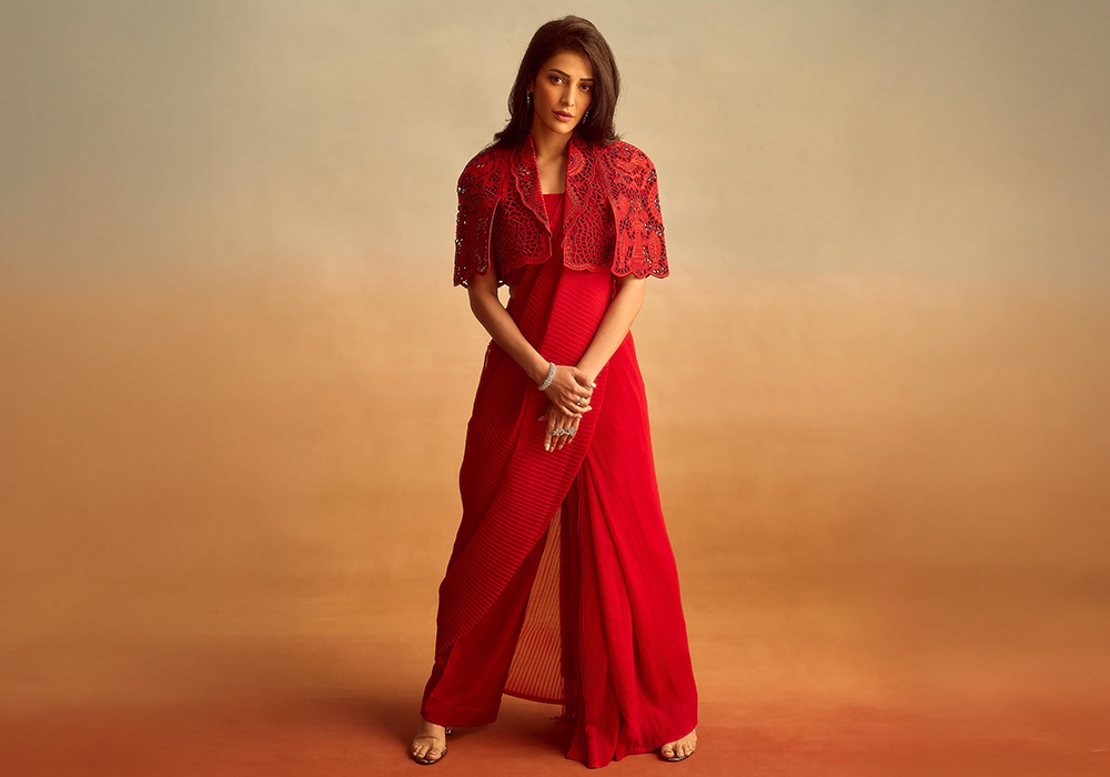 Shruti Hassan wearing red pant saree with jacket