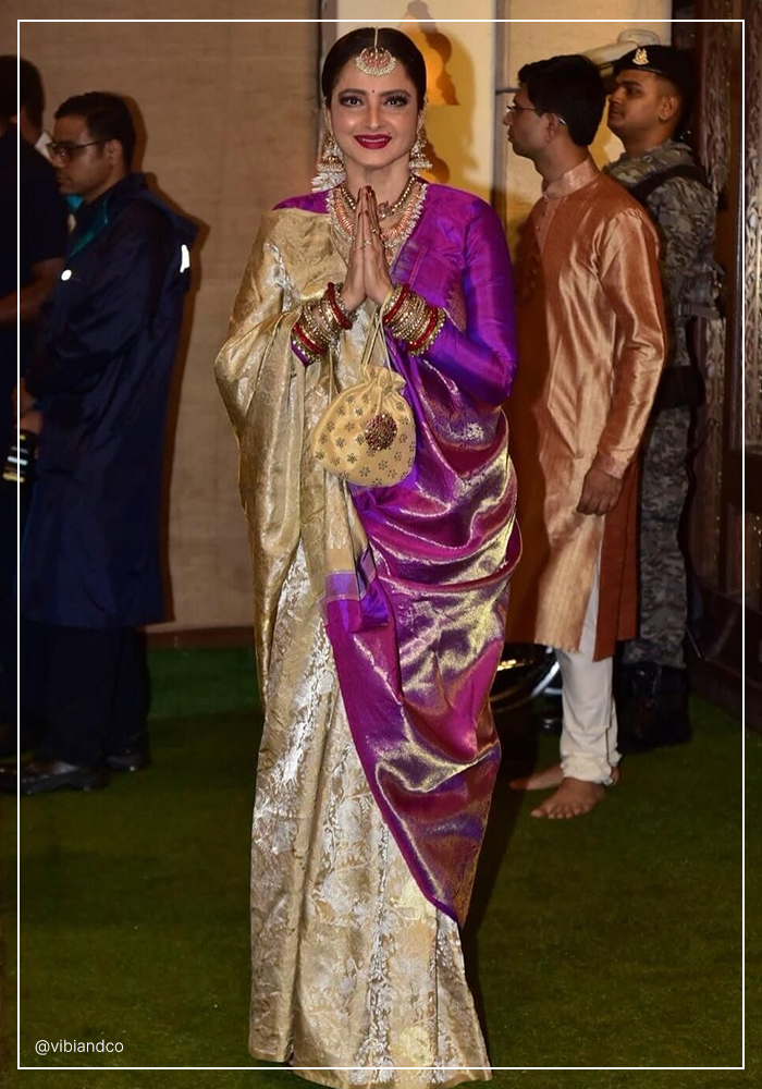 Rekha ji in goden and purple saree