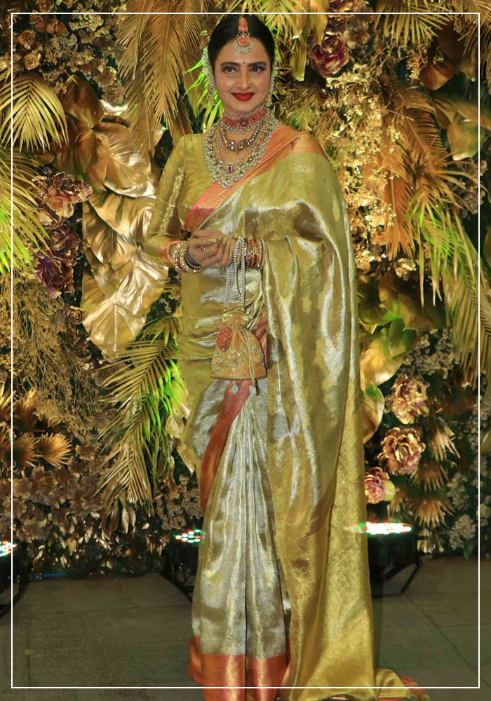 Rekha ji in green and gold saree