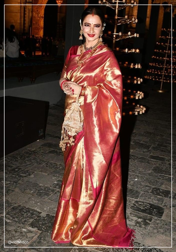 Rekha ji in red and gold saree