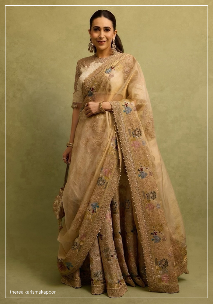 Karisma Kapoor wearing ivory and gold lehenga