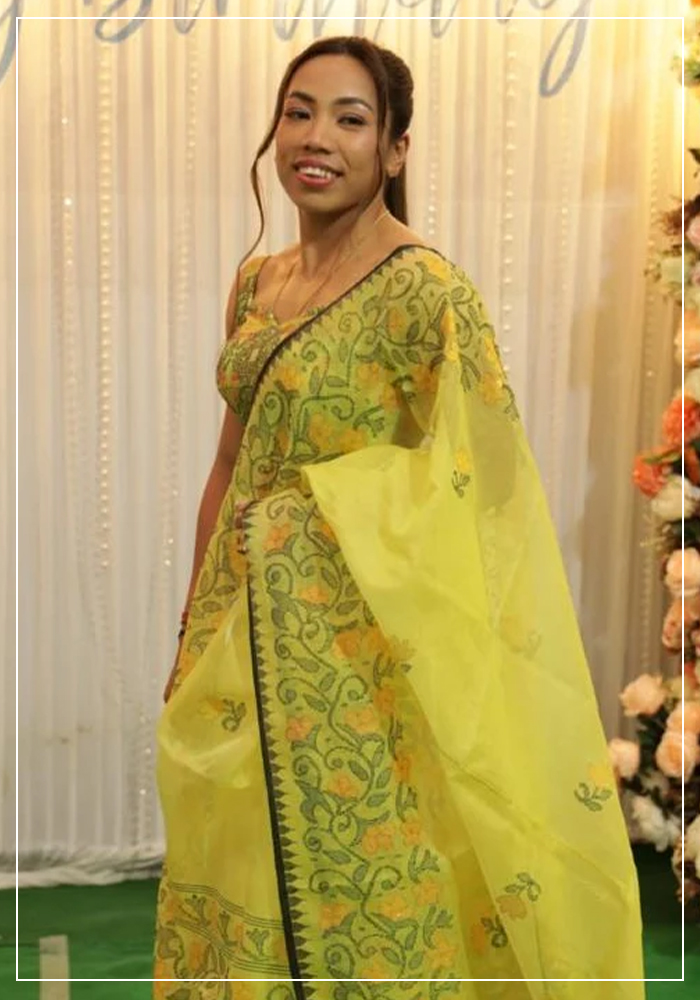 Mirabai Chanu wearing yellow jamdani saree