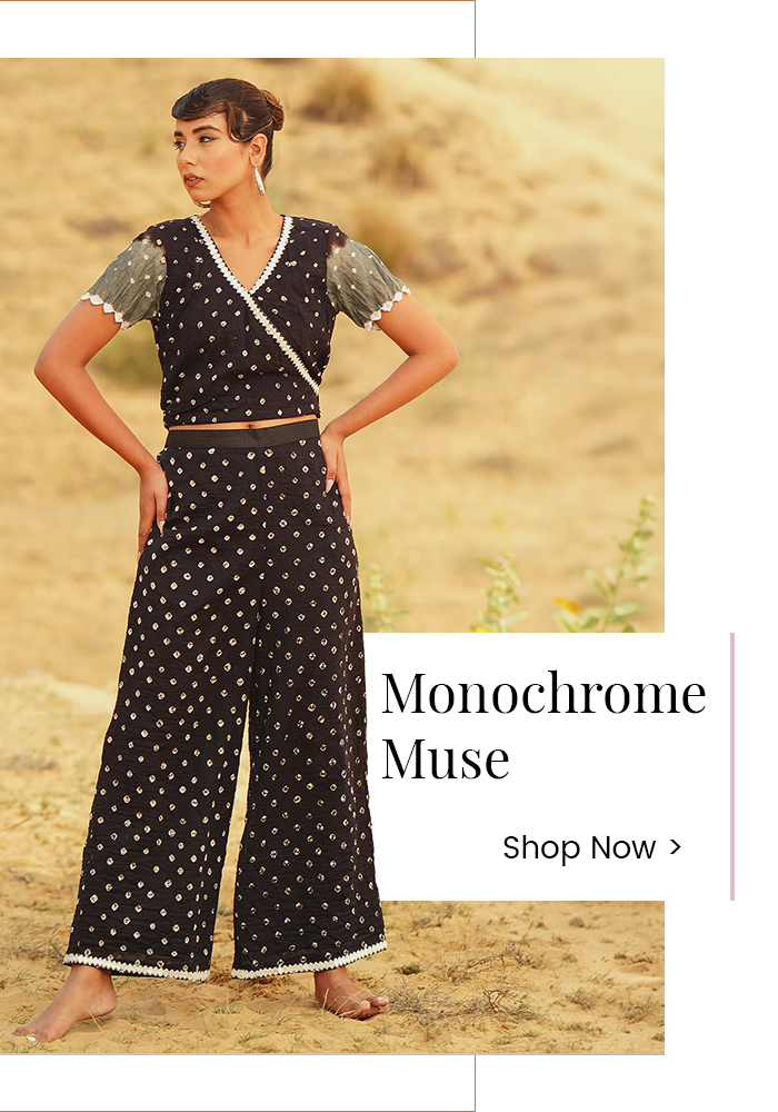 Model wearing a black monochrome designer co-ord set inspired by mystery book fashion