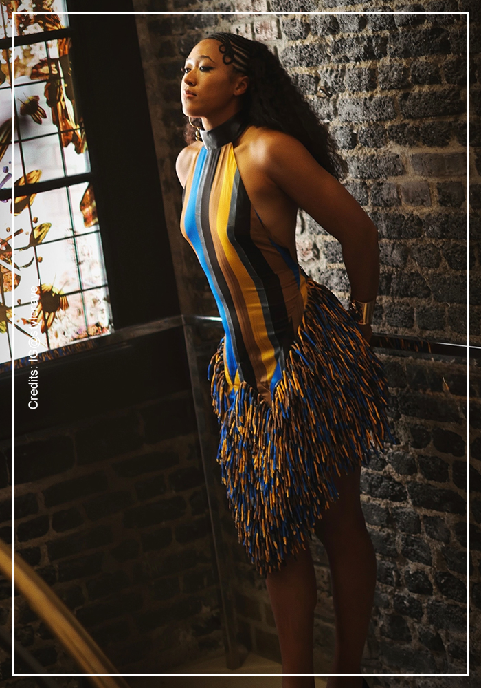 Naomi in striped mini halter dress