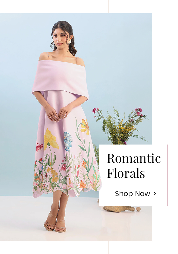 Model wearing a pastel floral designer dress representing the Romantic Florals fashion aesthetic inspired by romance books