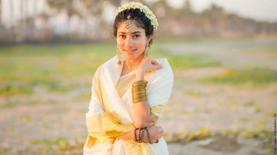 Sai Pallavi wearing kasavu saree and traditional temple jewellery on Onam