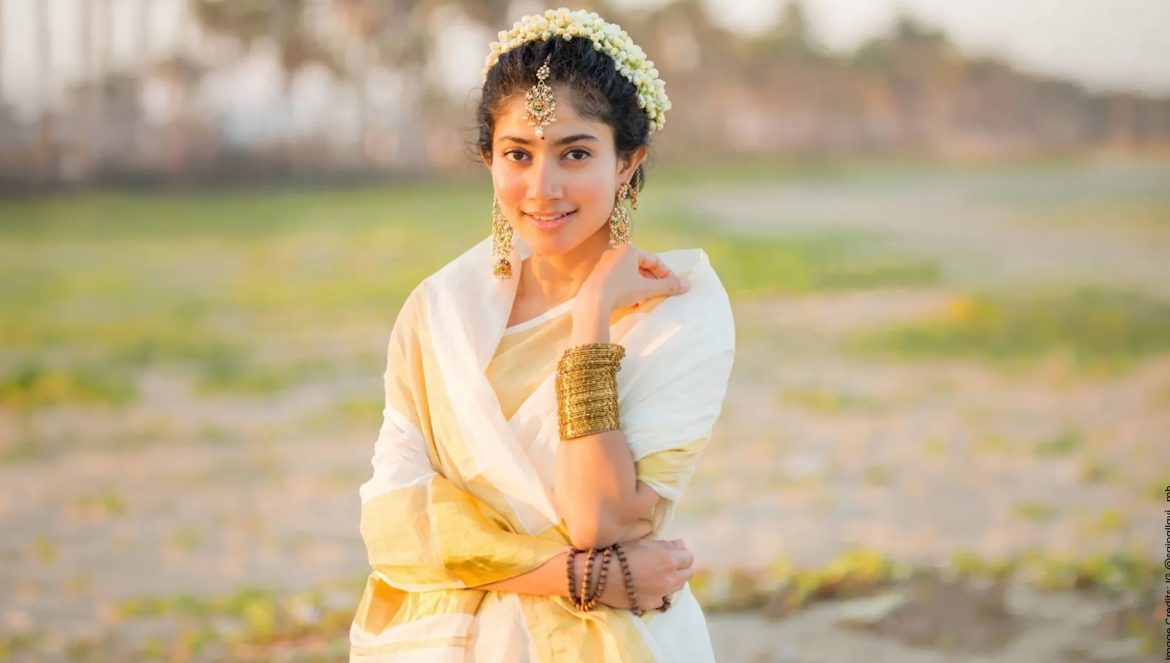 Sai Pallavi wearing kasavu saree and traditional temple jewellery on Onam