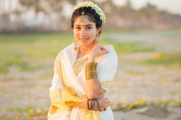 Sai Pallavi wearing kasavu saree and traditional temple jewellery on Onam