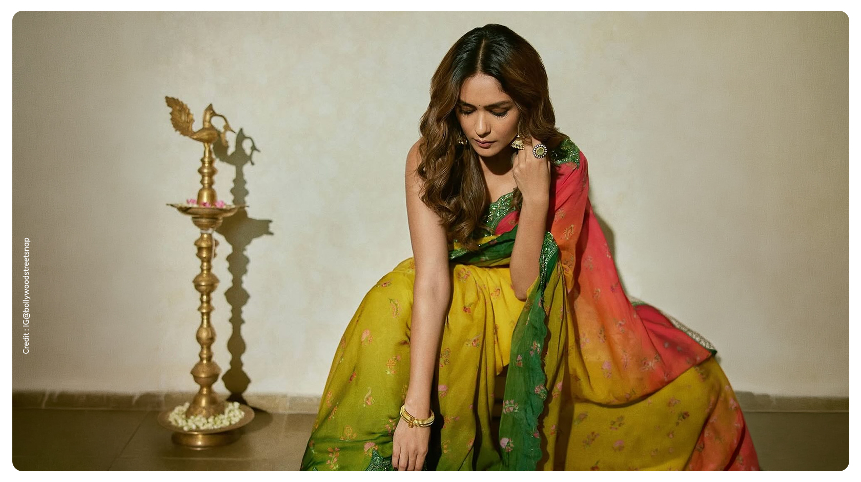 Mrunal Thakur wearing green saree