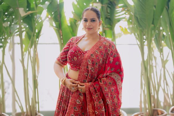 Influencer Abhinisha Jani Ashara wearing maroon Samyukta Singhania lehenga from Aza Fashions