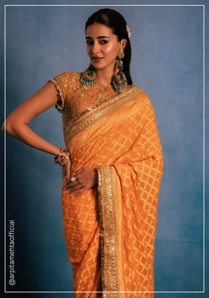 Ananya Panday wearing orange Arpita Mehta saree for Ganesh Chaturthi ceebrations