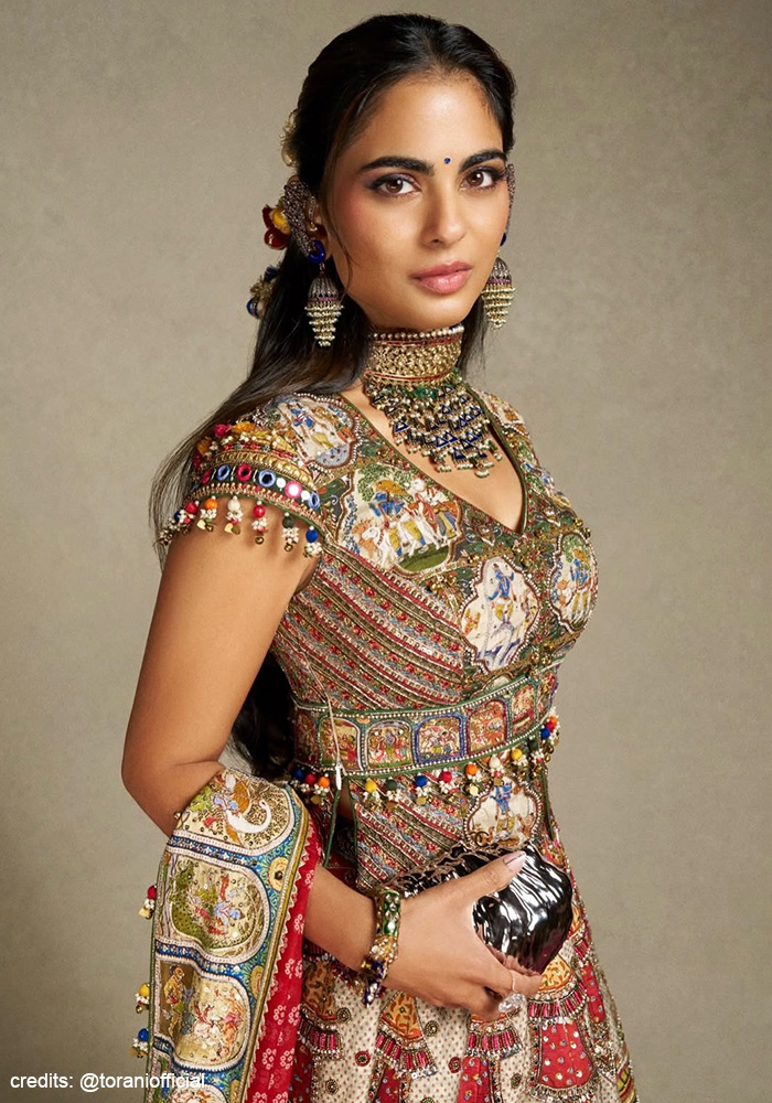 Isha Ambani wearing shirt-style choli with her Torani lehenga