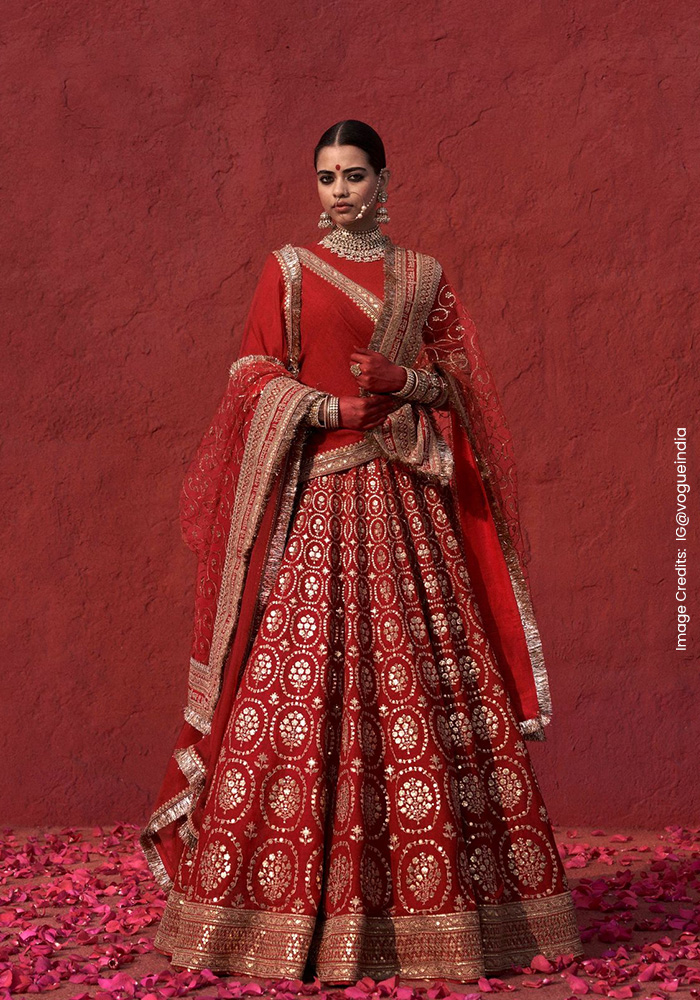 15 Designers Who Make Red Bridal Lehengas Unforgettable